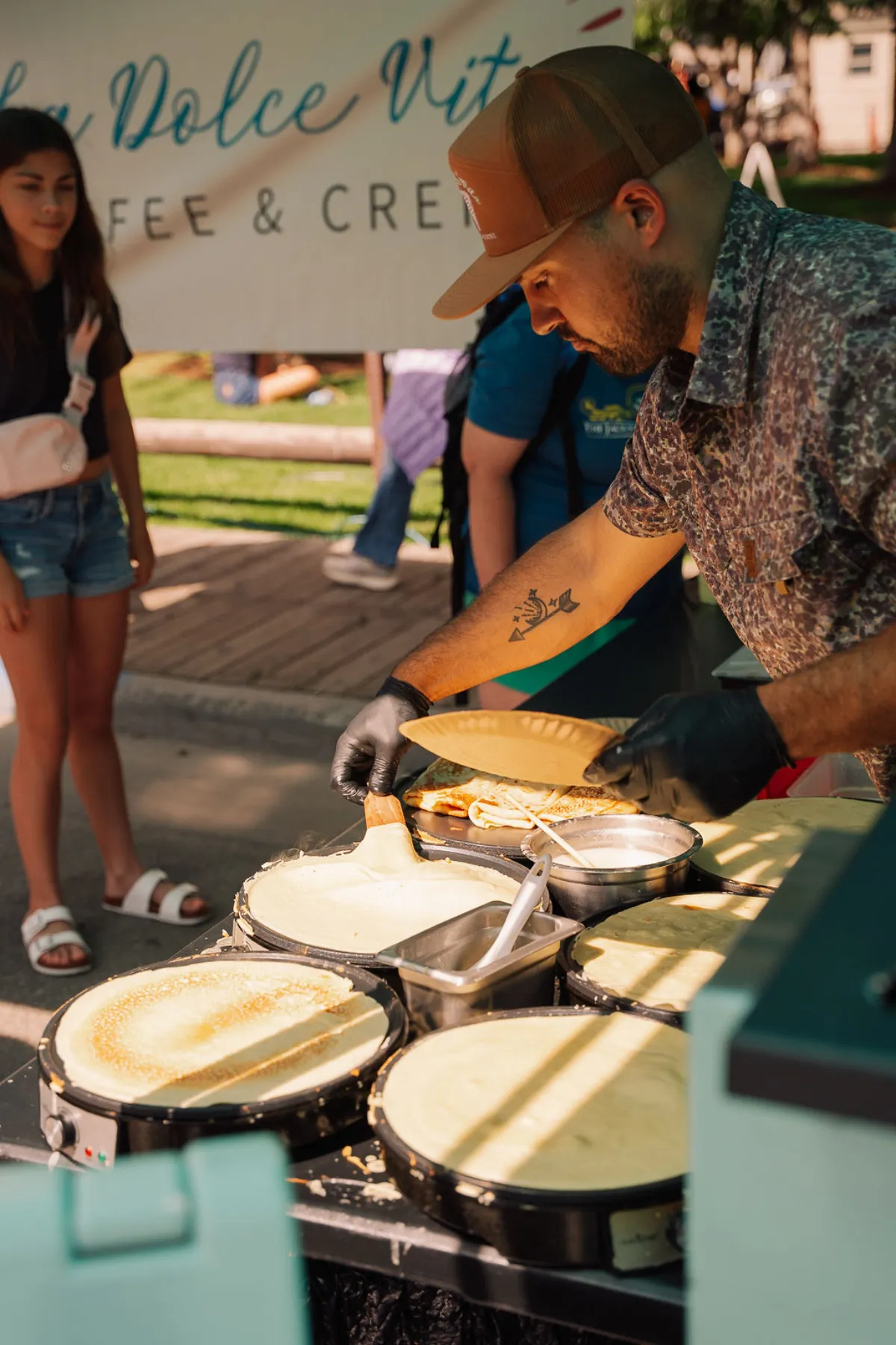 La Dolce Vita vendor making fresh crepes on the griddle