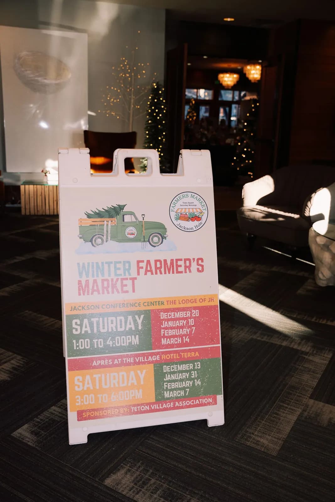 The Winter Farmers Market chalkboard sign at the entrance